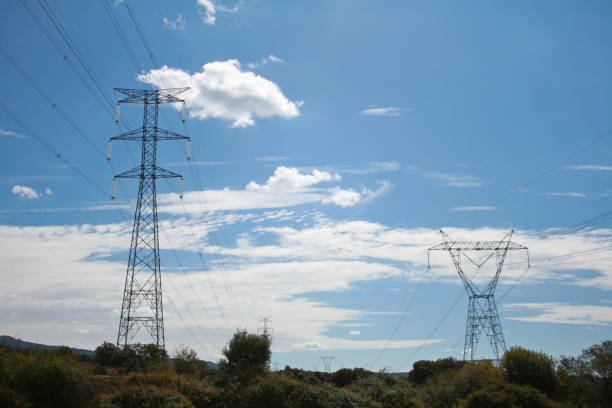 istock high voltage electrical tower under the blue sky, profiles and cables highlighted 1477769211