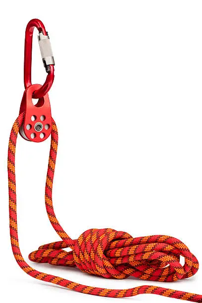 Climbing equipment - pulley, rope, carabiner. Isolated on a white.