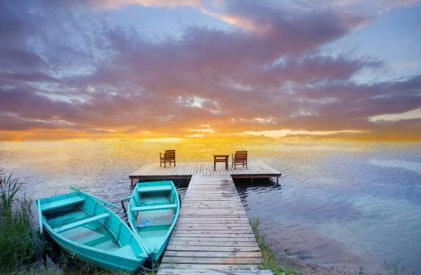 istock Boats, jetty and beautiful colourful sunset 1477769804