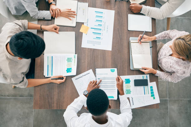 istock Collaboration, documents and financial with a business team working together in an accounting office from above. Meeting, data and finance planning with a man and woman accounting group at work 1477775168