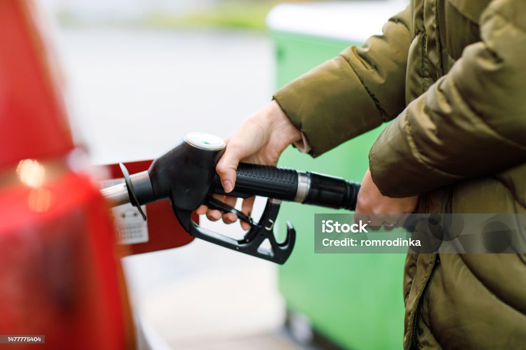 Manie Bliksem zelf Closeup Of Hands Of Woman At Selfservice Gas Station Hold Fuel Nozzle And Refuel The Car With Petrol Diesel Gas Close Up Of Filling Auto With Gasoline Or Benzine Self Service Gas Manie Bliksem zelf Closeup Of Hands Of Woman At Selfservice Gas Station Hold Fuel Nozzle And Refuel The Car With Petrol Diesel Gas Close Up Of Filling Auto With Gasoline Or Benzine Self Service Gas