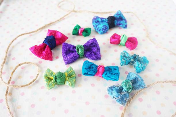 istock Colorful bow tie on white fabric with polka dot background 1477776772