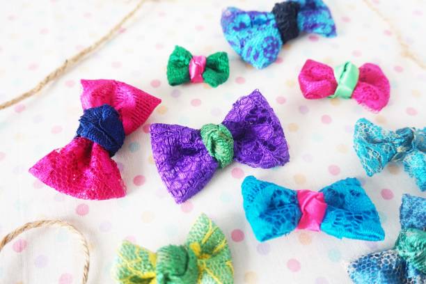 istock Colorful bow tie on white fabric with polka dot background 1477776811