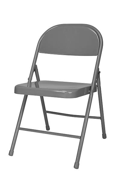 Folding chair Metal folding chair isolated over a white background foldable stock pictures, royalty-free photos & images