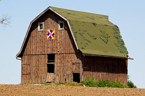 Old wood barn on a hill stock photo