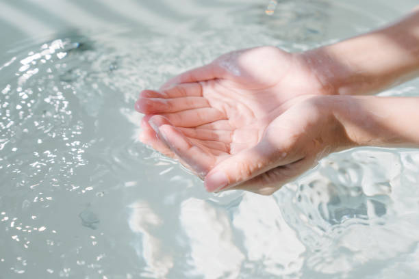 Close up hand of woman enjoy take a bath in hot tub stock photo
