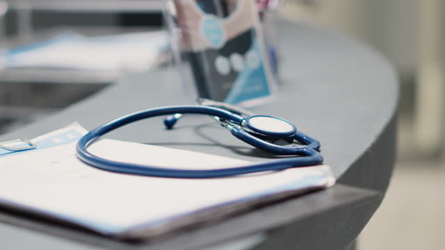 Papers and stethoscope on front desk