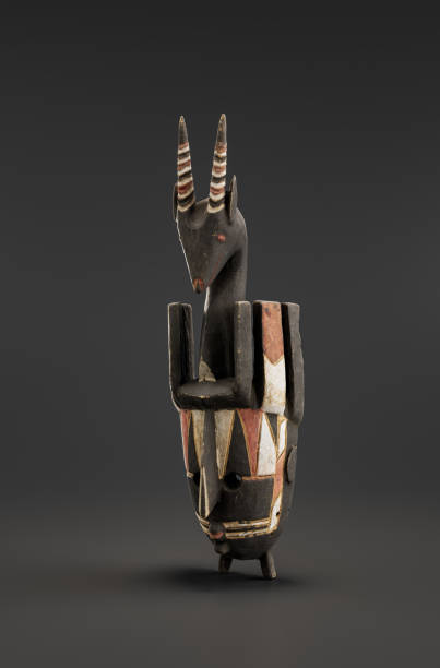 istock Decorative n’tomo mask from Bambara people, Ritual mask. from side view, 3d Rendering 1477780694