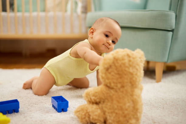 Cute little baby boy, playing at home, crawling