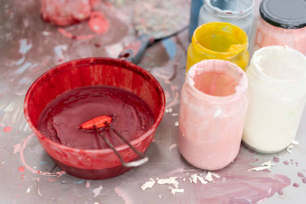 Close-up of red, blue, yellow, pink icing for cakes