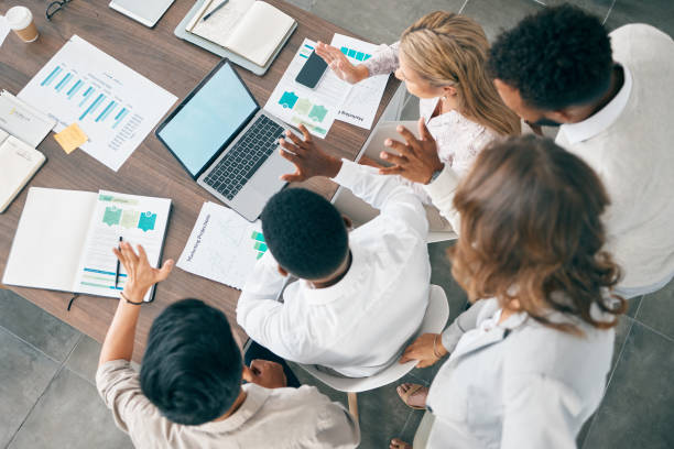istock Collaboration, documents and financial with a business team working together in an accounting office from above. Meeting, data and finance planning with a man and woman accountant group at work 1477783981