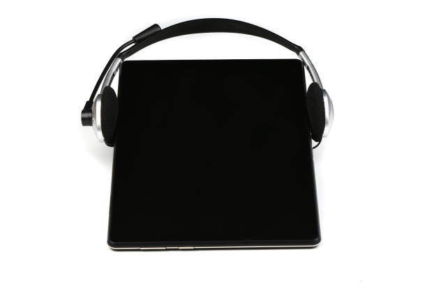 Headphones on tablet pc isolated on white background. High resolution photo. Full depth of field.