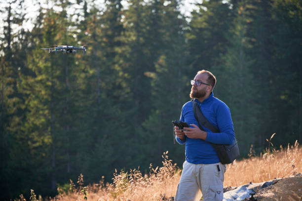 istock Professional photographer taking photos from drone. 1477787564