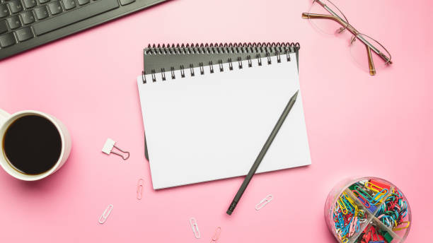 istock Composition with blank book and computer keyboard, coffee cup on color background 1477789757