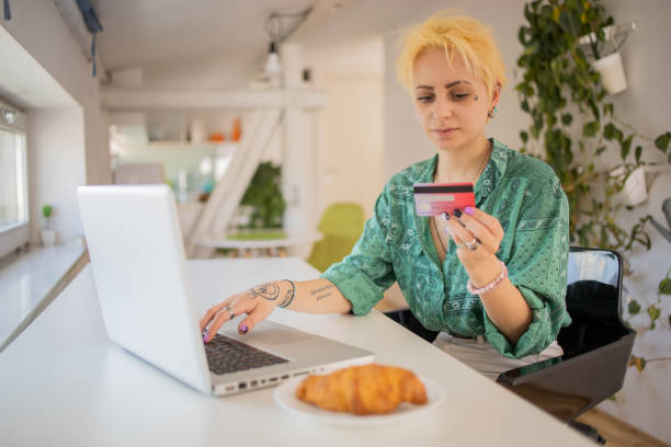 istock Happy young customer enjoys shopping online 1477791034