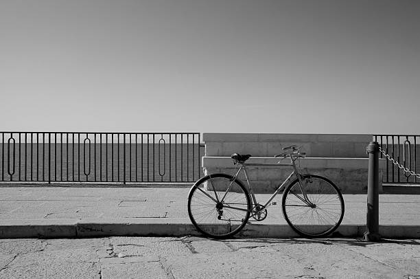 Bicycle parked on the coast of trani in soth of Italy