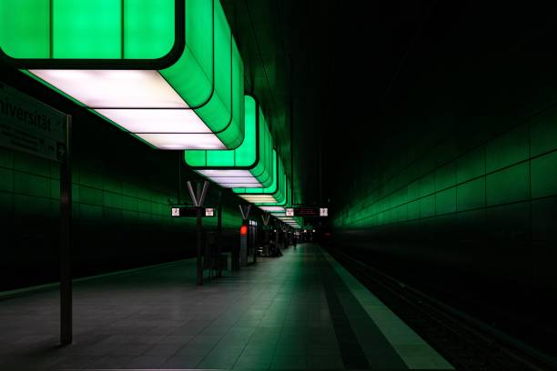 istock Urban subway platform illuminated by green lighting. 1477795818
