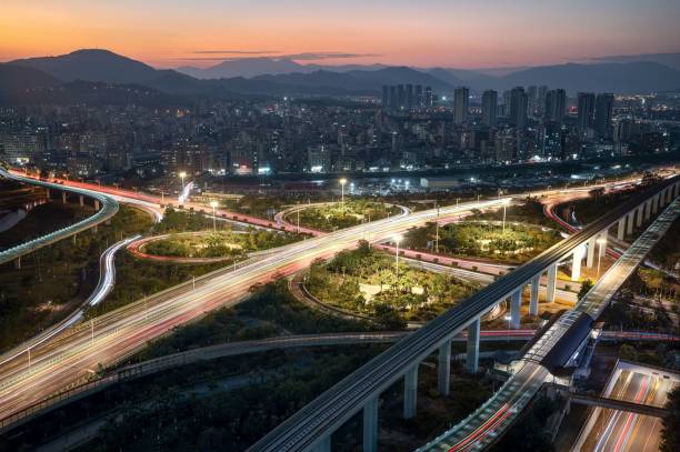 istock Freeways in an empty city at dusk with the sun setting 1477796942