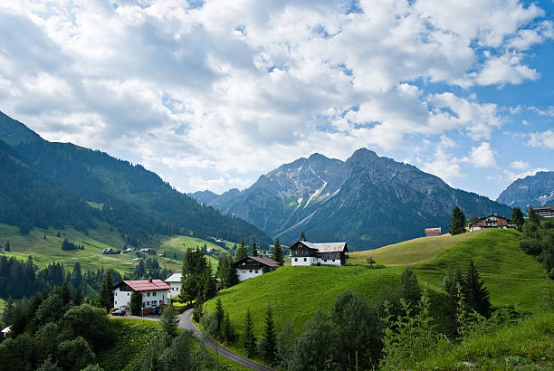 Village in the Alps A small village in the austrian alps at the Kleinwalsertal kleinwalsertal stock pictures, royalty-free photos & images