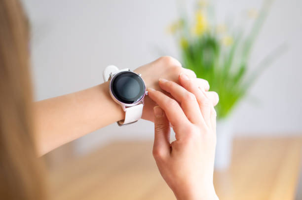 istock Hands of a woman wearing a smart watch. 1477802458