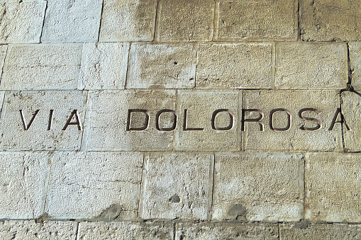 The inscription on the wall, VIA DOLOROSA, Painful path, a street sign in Jerusalem, Israel