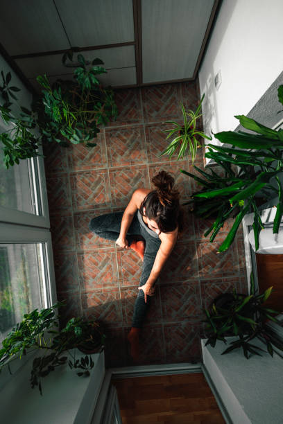 istock Woman exercising at home 1477804199