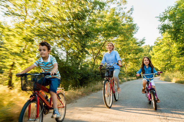 istock Family riding bicycle together 1477805704