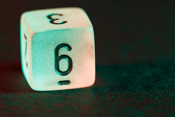dice with reflection on black background, copy space