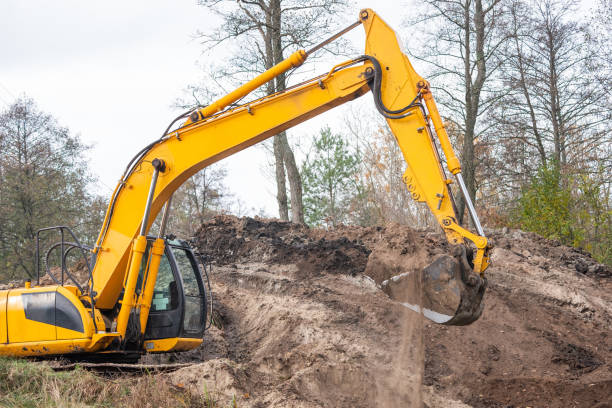 istock Big powerful excavator digging in countryside 1477812341