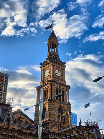 The Sydney Town Hall building on the background of the cloudy sky