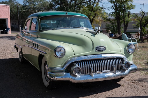Tucumcari, United States – August 17, 2022: Detail of a classic American Buick Special in lime color