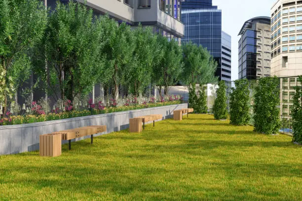 Photo of Building Exteriors And Terrace Garden With Trees, Bushes And Wooden Benches