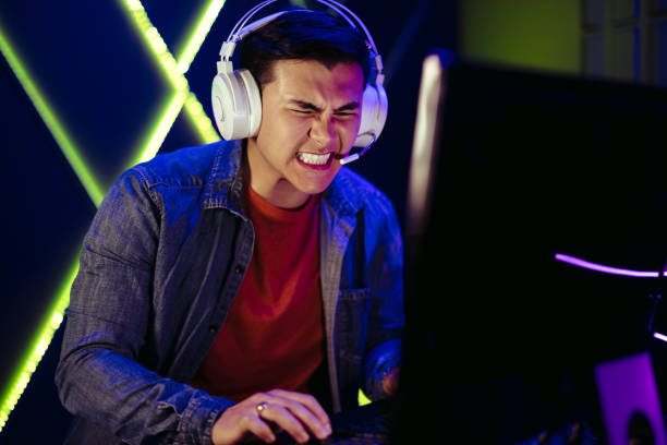 istock Gamer expressing frustration after missing a shot in an intense video game moment 1477816451