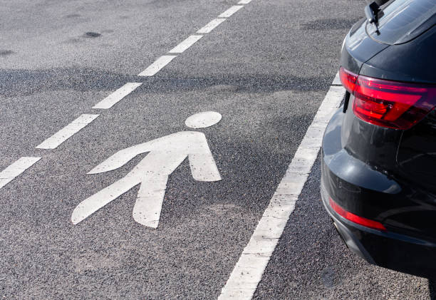 Man symbol as road warning sign. Focus on white painted man. Nikon D7000, Nikkor 16-85mm, high quality.