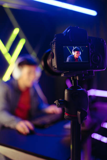 istock Gamer live streaming his gameplay to his online subscribers on a streaming service 1477816831