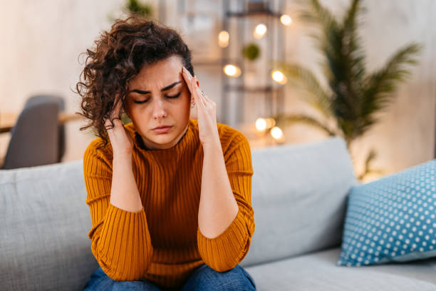 istock Young Woman Having A Headache At Home 1477817492