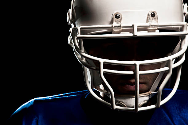 istock Football player with white helmet and blue jersey 147781925
