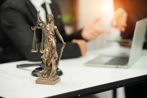 istock Lawyer sitting with team at office 1477820220