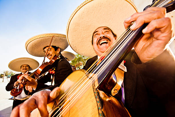 Mariachi Band Group of four Musicians playing Mariachi music latin music photos stock pictures, royalty-free photos & images