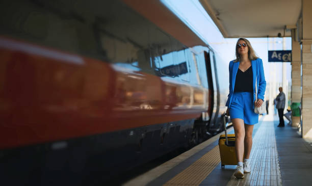 istock Woman walks along the platform at the train station. 1477820902