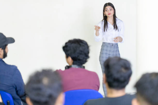 istock Young speaker giving a reason to a member of the audience 1477822390