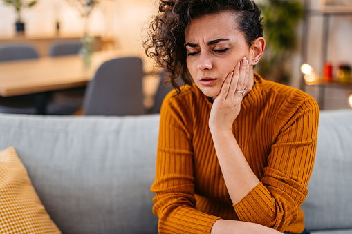 Young Woman Having Toothache At Home