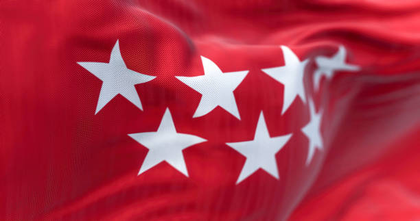 Detail of the Community of Madrid flag waving Detail of the Community of Madrid flag waving in the wind. Crimson red with seven silver five-pointed stars. 3d illustration render. Selective focus. Rippled textile the flag of the madrid spain stock pictures, royalty-free photos & images