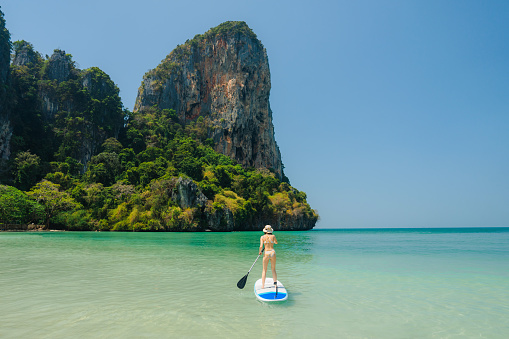 Pang Nga, Thailand - March 16, 2011 : Tourists starting their kayaking in the hongs in Pang Nga Bay from a big nautical vessel