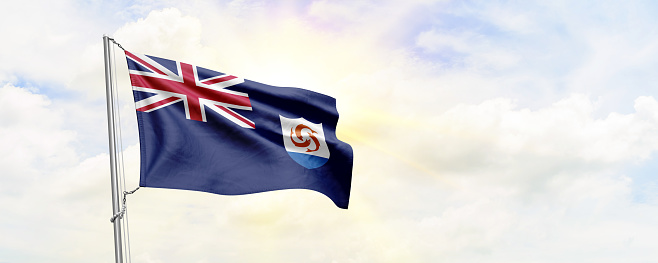 Anguilla flag waving on sky background. 3D Rendering
