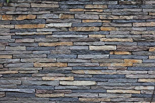 colorfull pared de piedra - pared de piedra fotografías e imágenes de stock