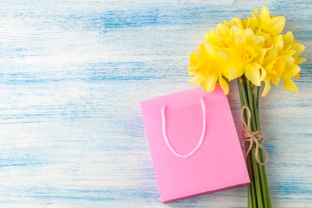 istock Bouquet of daffodils, spring flowers on a blue background. view from above. 1477831858