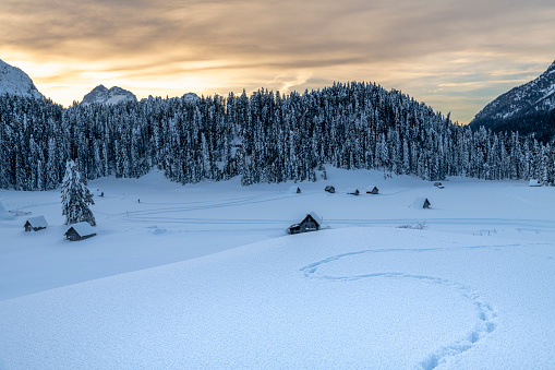 Magical atmosphere of snow and ice in Sappada, as it prepares to fall in the evening.