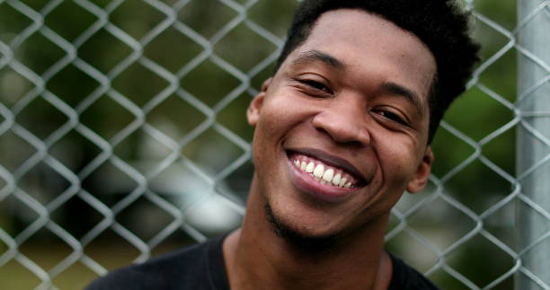 istock African american black guy smiling and feeling happy 1477836516
