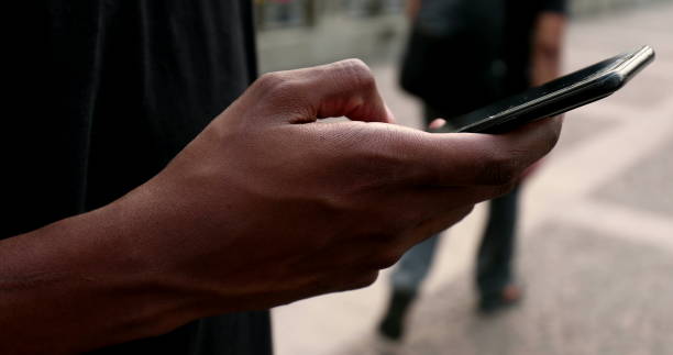 istock African man using cellphone in city 1477836606
